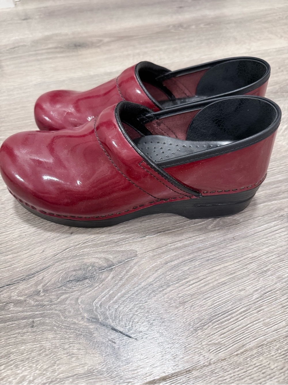Dansko Women's Red Leather Slip-On Clogs with Black Trim
